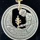 Marsh-Billings-Rockefeller National Historic Preserve Quarter Hand Cut Coin Necklace with a 24k Gold Plated Plant and chain on a black velvet background.- Mountainstruck Coin Jewelry