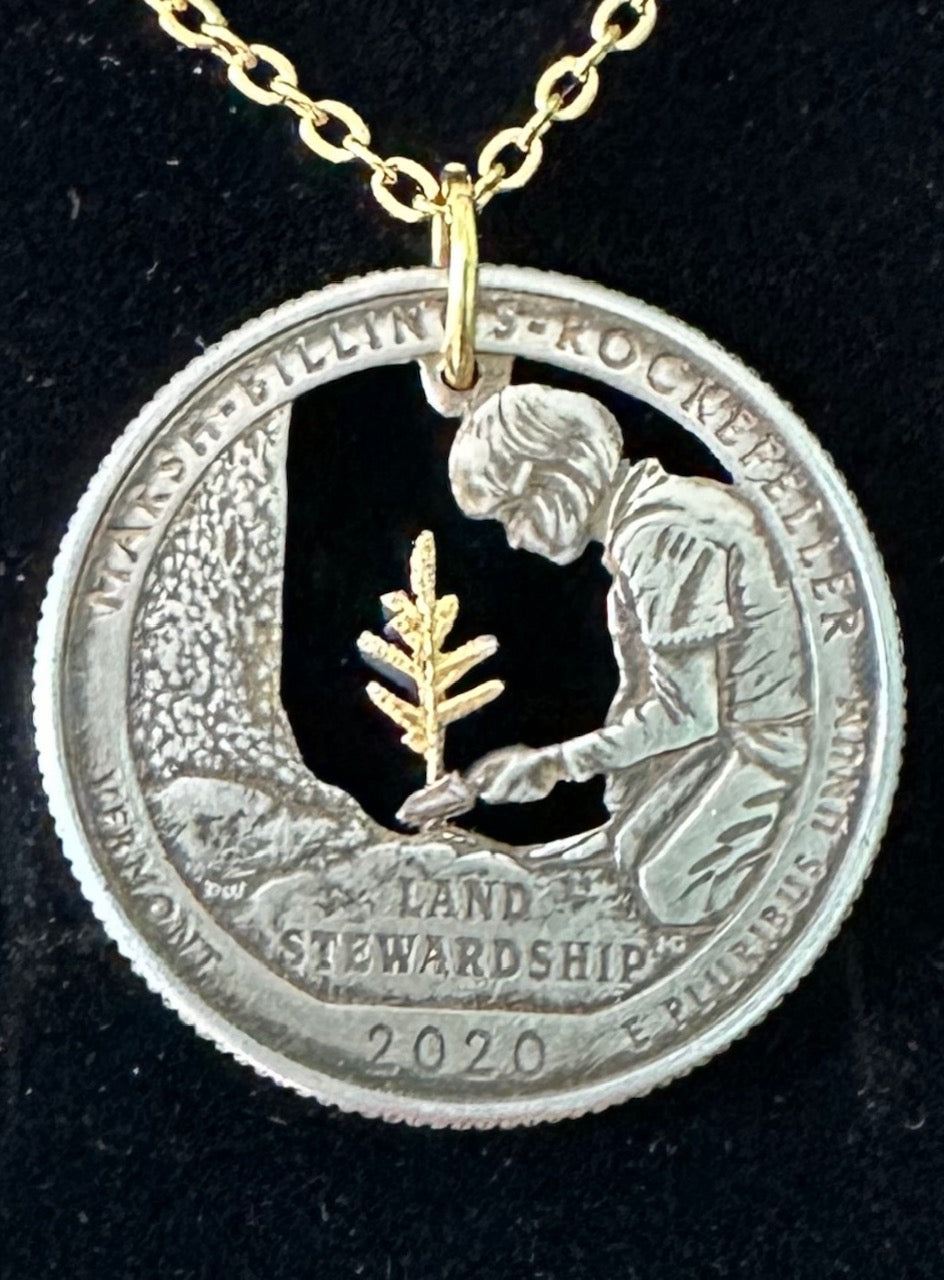 Marsh-Billings-Rockefeller National Historic Preserve Quarter Hand Cut Coin Necklace with a 24k Gold Plated Plant and chain on a black velvet background.- Mountainstruck Coin Jewelry