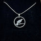 Huia Bird Silver New Zealand 6 Pence Hand Cut Coin Necklace on a black velvet background. - Mountainstruck Coin Jewelry
