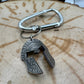 Hand cut and molded Spartan Helmet made from a U.S. Half Dollar on a silver carabiner . - Mountainstruck Coin Jewelry