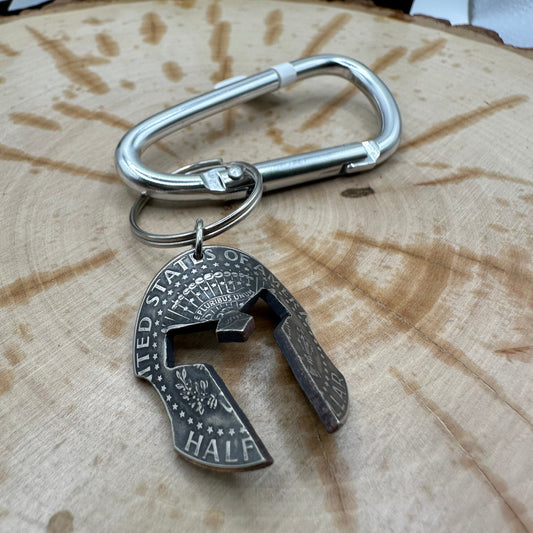 Hand cut and molded Spartan Helmet made from a U.S. Half Dollar on a silver carabiner . - Mountainstruck Coin Jewelry