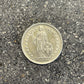 Silver Lady Swiss 1 Franc Coin front on a concrete background.  - Mountainstruck Coin Jewelry
