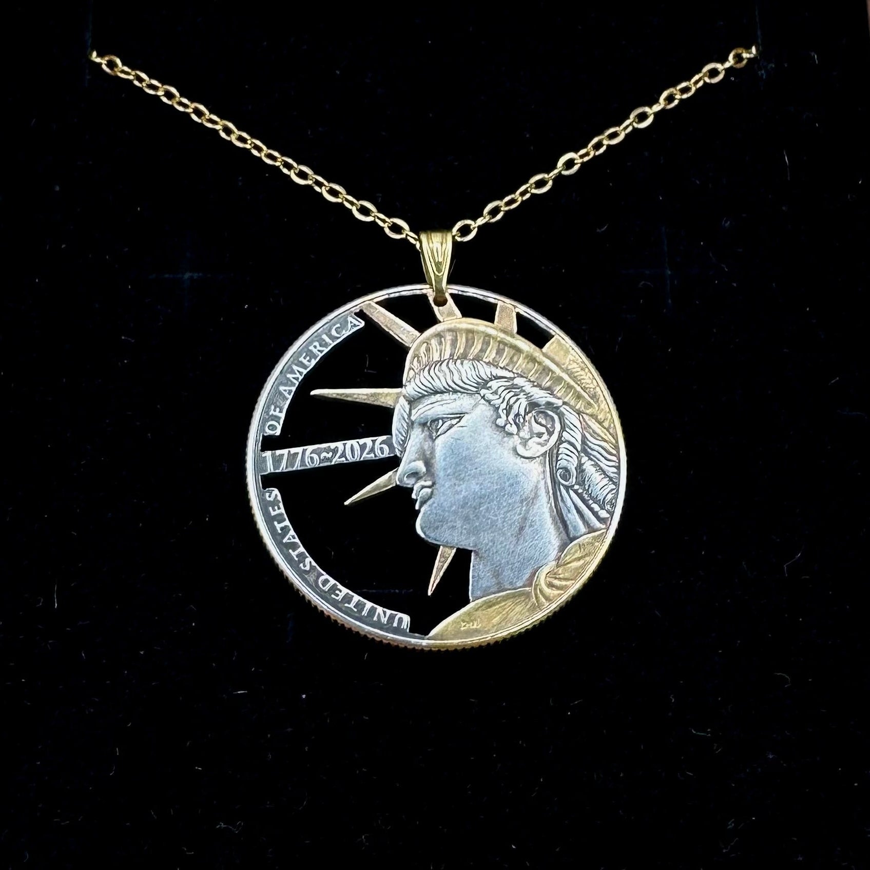 U.S. Half Dollar Hand Cut Coin Necklace (front) 24k gold plated with a gold plated chain on a black velvet background. - Mountainstruck Coin Jewelry