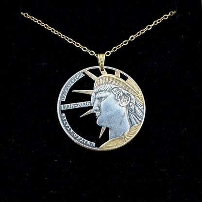 U.S. Half Dollar Hand Cut Coin Necklace (front) 24k gold plated with a gold plated chain on a black velvet background. - Mountainstruck Coin Jewelry