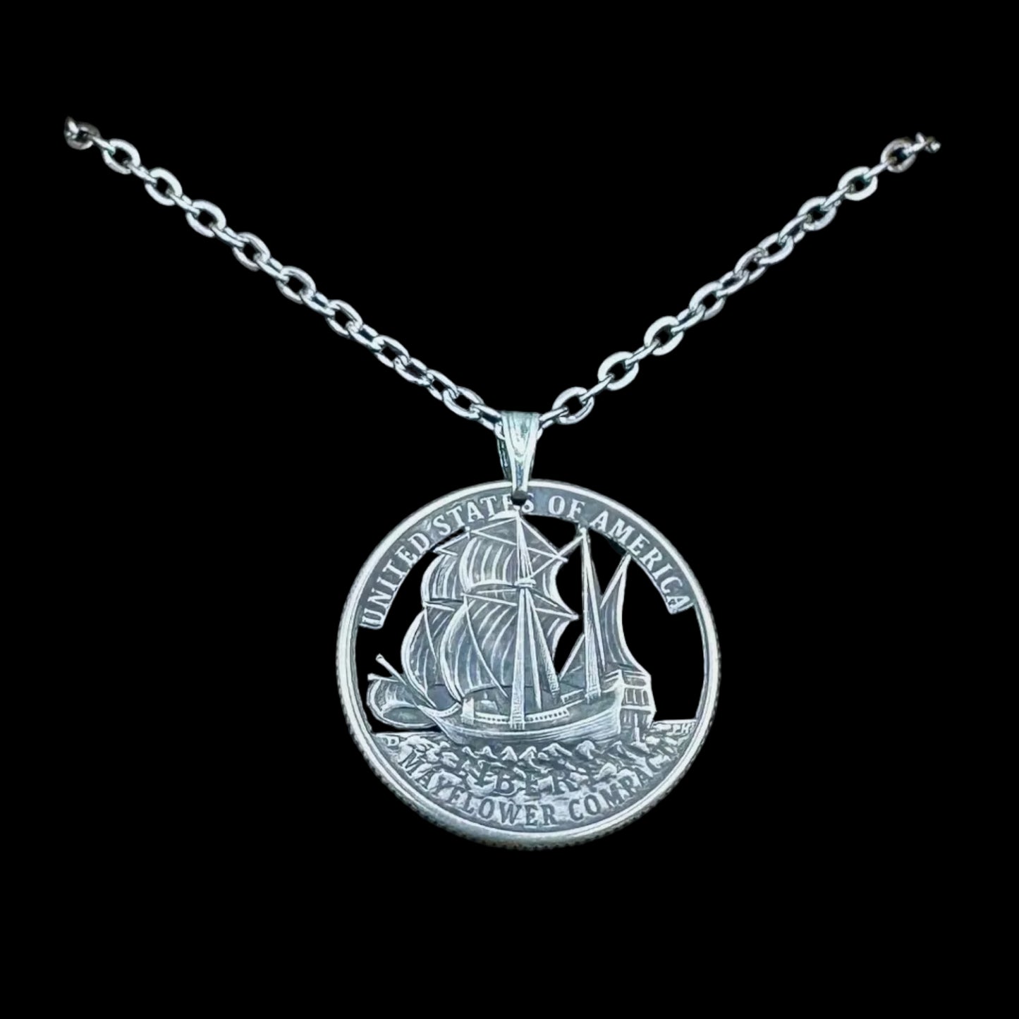 U.S. 2026 "Mayflower" Quarter Hand Cut Coin Necklace with a stainless chain on a black background. - Mountainstruck Coin Jewelry