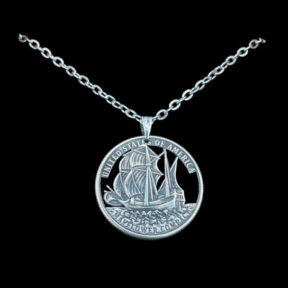U.S. 2026 "Mayflower" Quarter Hand Cut Coin Necklace with a stainless chain on a black background. - Mountainstruck Coin Jewelry
