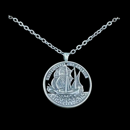 U.S. 2026 "Mayflower" Quarter Hand Cut Coin Necklace with a stainless chain on a black background. - Mountainstruck Coin Jewelry
