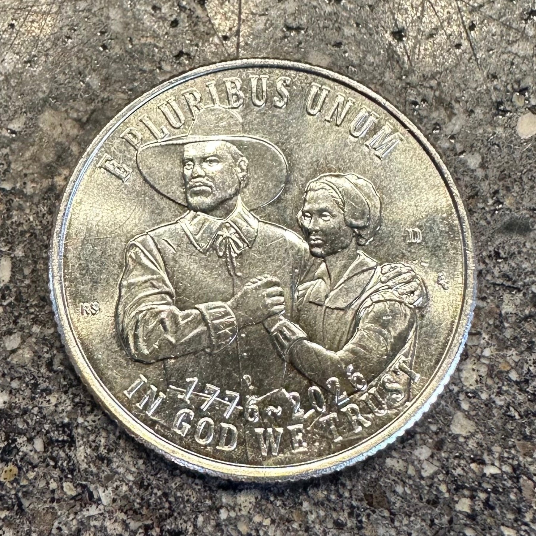 U.S. 2026 "Pilgrim" Quarter Coin on a concrete background. -Mountainstruck Coin Jewelry