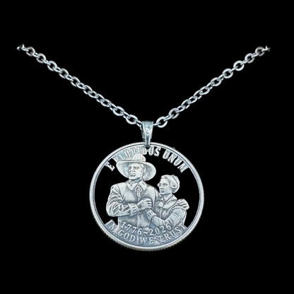 U.S. 2026 "Pilgrim" Quarter Hand Cut Coin Necklace with a stainless chain on a black background. -Mountainstruck Coin Jewelry