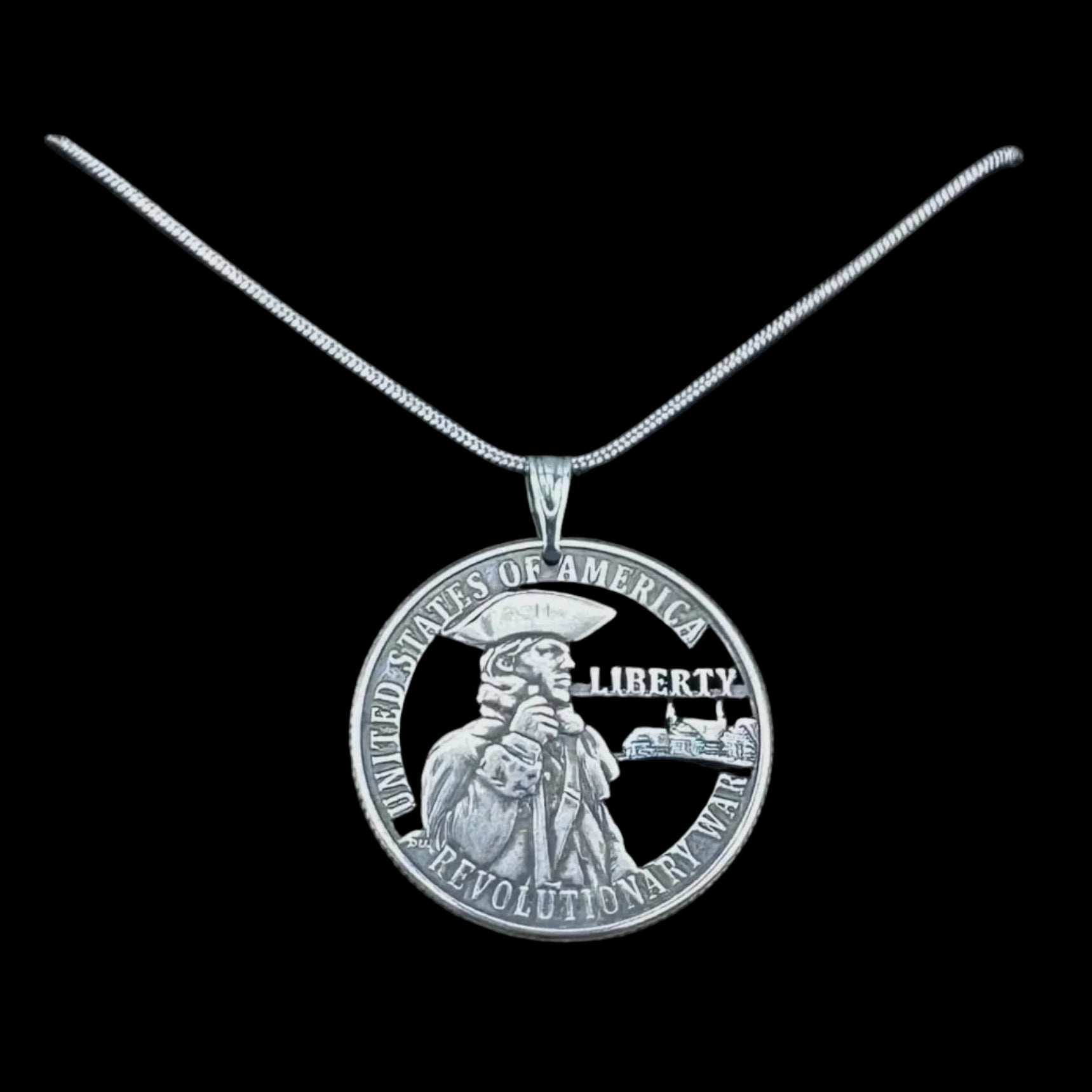 U.S. 2026 "Revolutionary War" Quarter Hand Cut Coin Necklace on a black background. - Mountainstruck Coin Jewelry