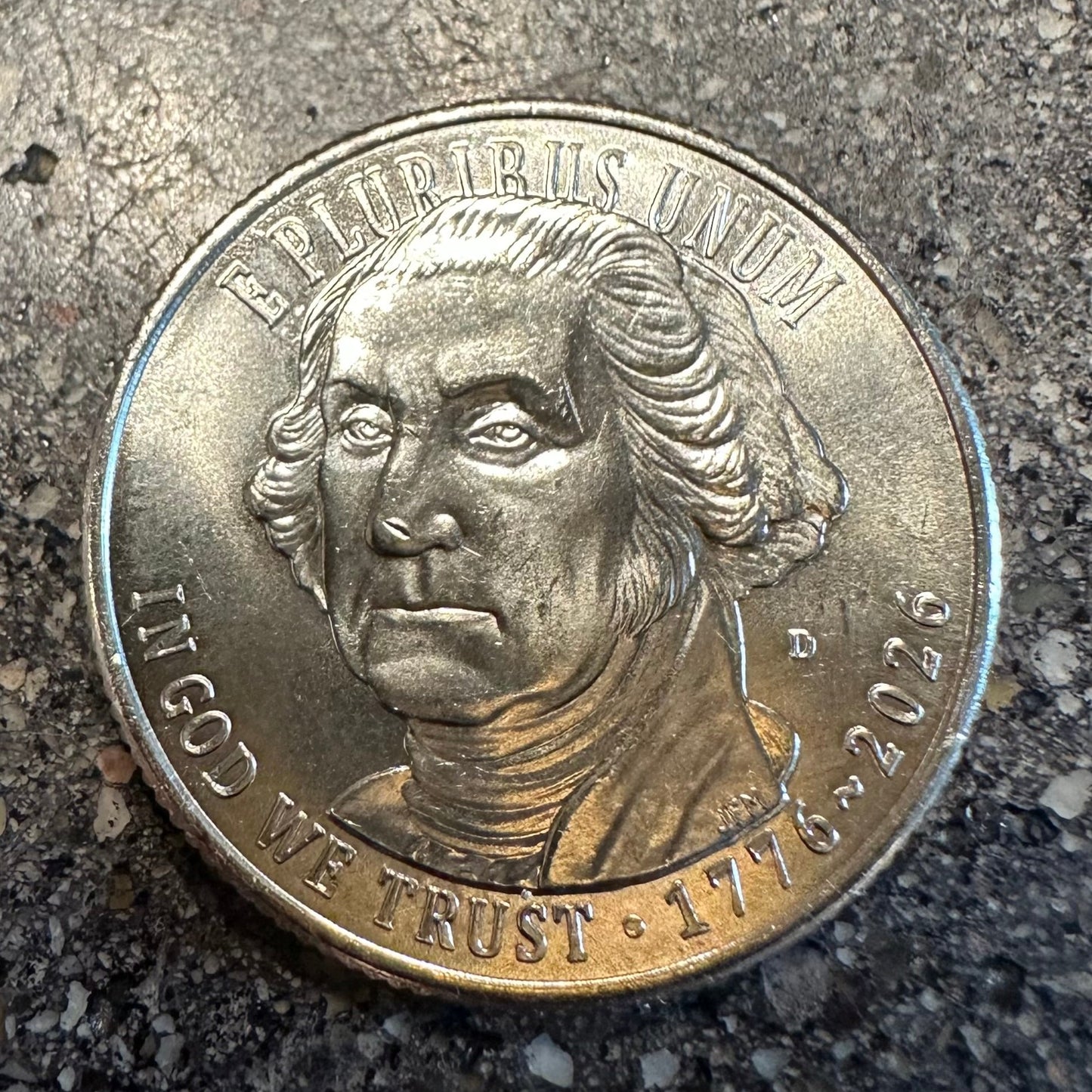 U.S. 2026 "Revolutionary War" Quarter Coin front on a concrete background. - Mountainstruck Coin Jewelry