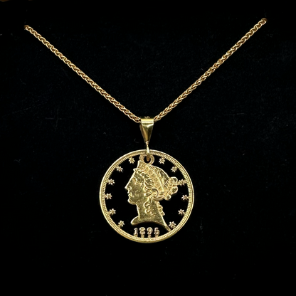 U.S. 22k Gold Half Eagle Hand Cut Necklace on a black velvet background. - Mountainstruck Coin Jewelry