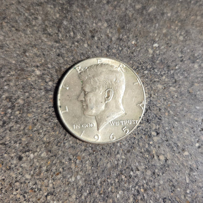 U.S. JFK Eagle Half Dollar Silver Coin front on a concrete background. - Mountainstruck Coin Jewelry