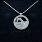 U.S. Arches National Park Hand Cut Coin Necklace with snake chain on a black velvet background. - Mountainstruck Coin Jewelry
