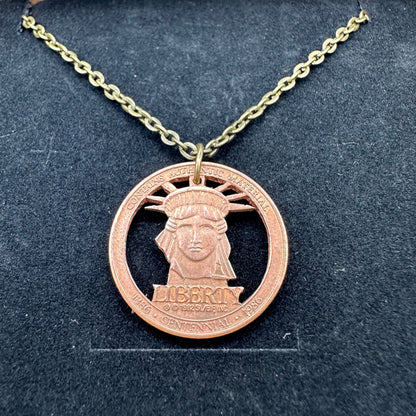 Close up of Authentic Copper Statue of Liberty Token hand cut coin necklace - Mountainstruck Coin Jewelry