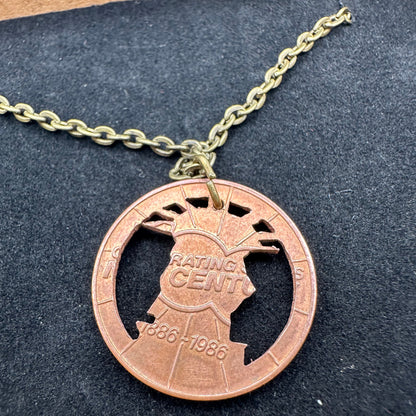Close up back of authentic Copper Statue of Liberty Token hand cut coin necklace - Mountainstruck Coin Jewelry
