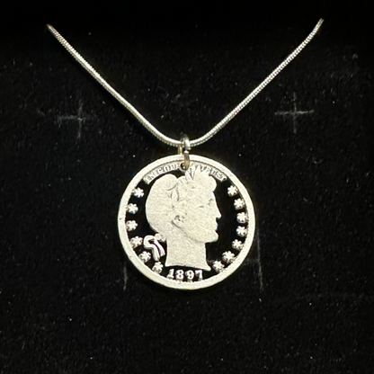 U.S. Barber Quarter Hand Cut Silver Coin Necklace with a snake chain on a black velvet background. -Mountainstruck Coin Jewelry