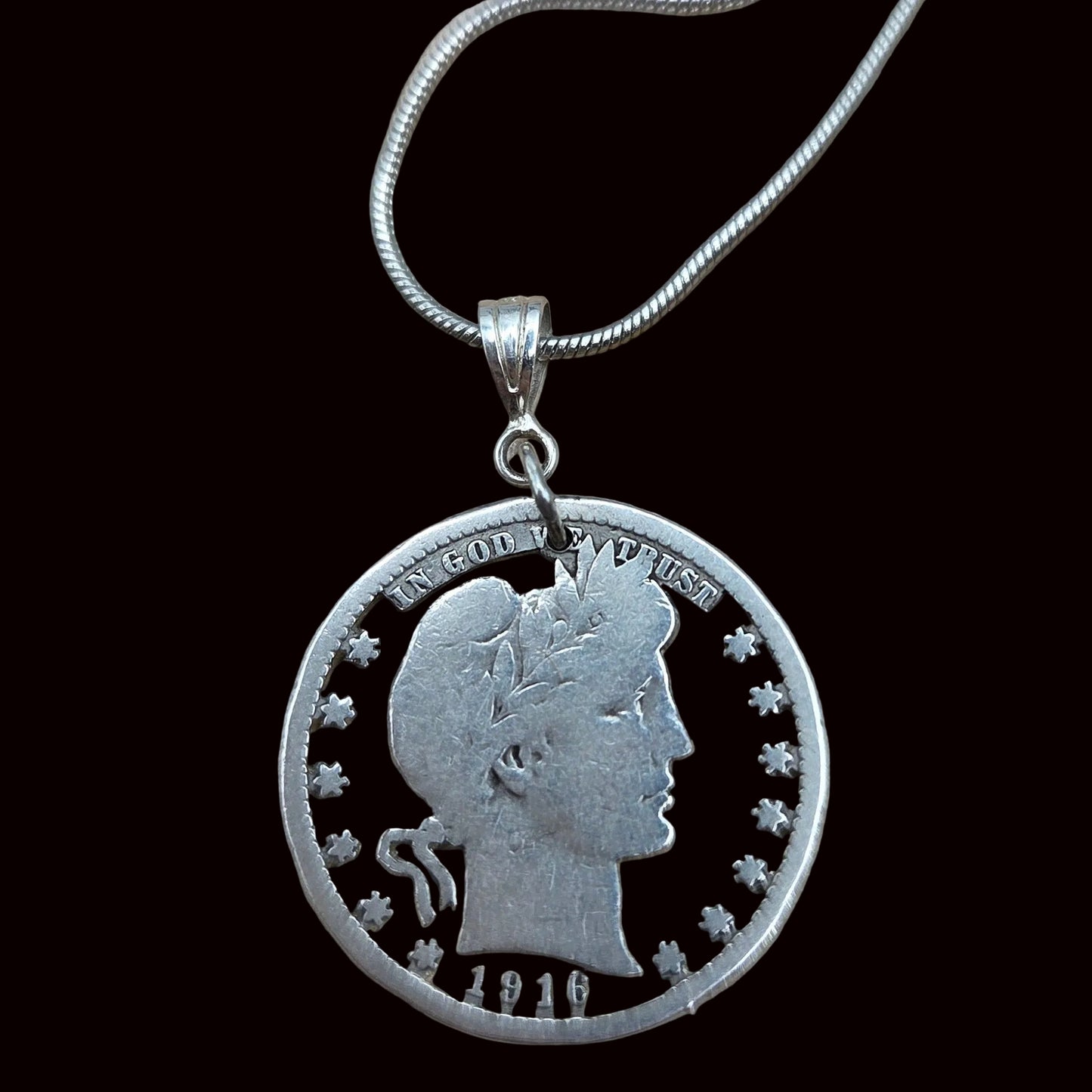 U.S. Barber Quarter Hand Cut Silver Coin Necklace with a snake chain on a black background. -Mountainstruck Coin Jewelry