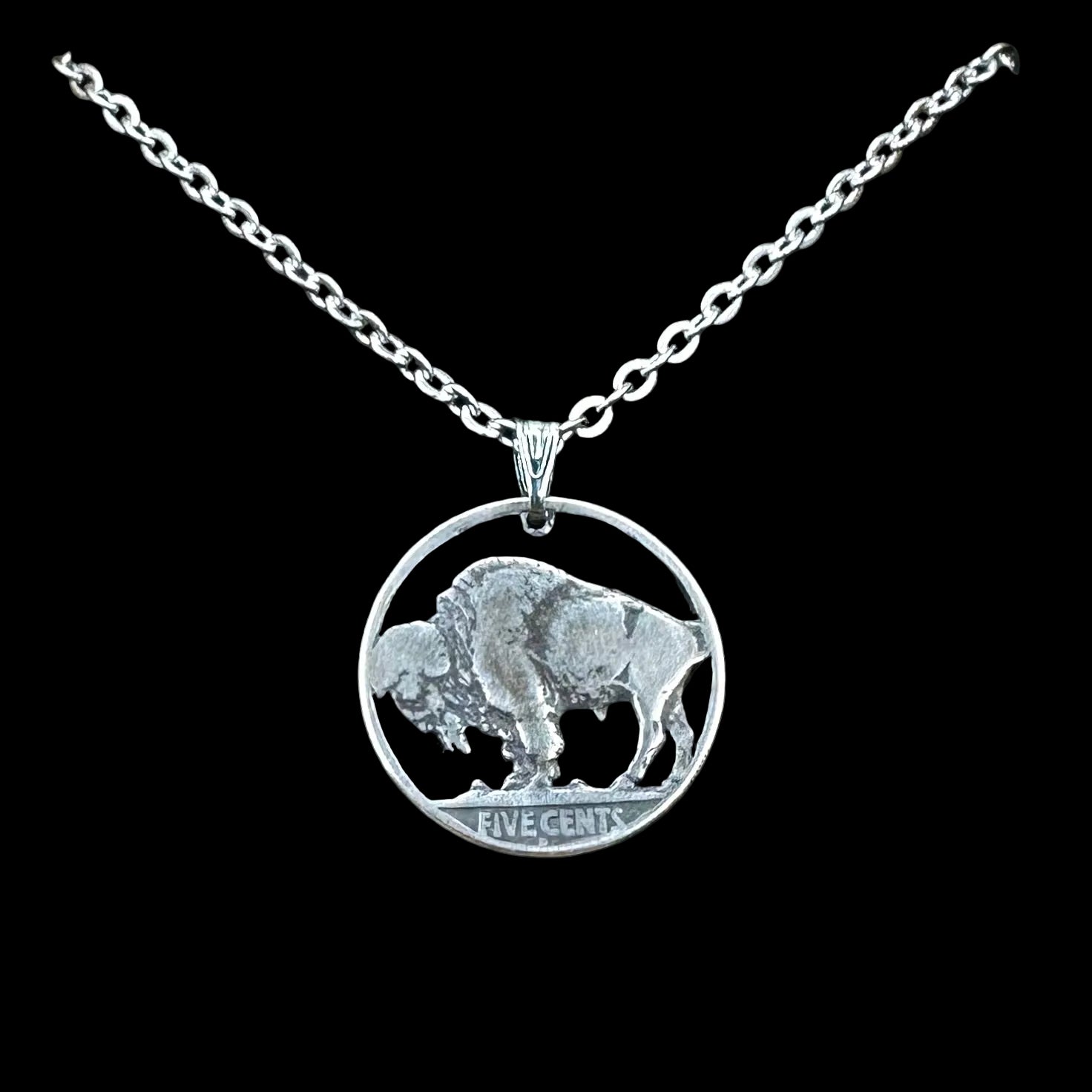 U.S. Buffalo Nickel Hand Cut Coin Necklace (Back) with a stainless chain in a brown kraft box on a black velvet background. - Mountainstruck Coin Jewelry