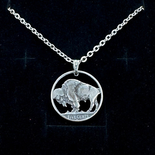 U.S. Buffalo Nickel Hand Cut Coin Necklace (Back) with a stainless chain in a brown kraft box on a black velvet background. - Mountainstruck Coin Jewelry