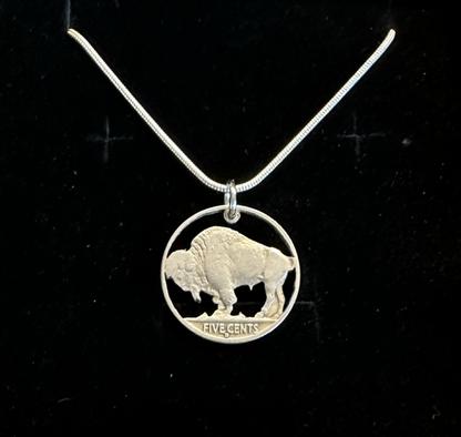 U.S. Buffalo Nickel Hand Cut Coin Necklace (Back) with a snake chain in a brown kraft box on a black velvet background. - Mountainstruck Coin Jewelry