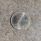 U.S. Butterfly Tallgrass Prairie Quarter Coin front on a concrete background - Mountainstruck Coin Jewelry