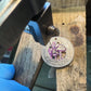 U.S. Custom Mushroom Quarter during the hand cutting process on a wood block. - Mountainstruck Coin Jewelry