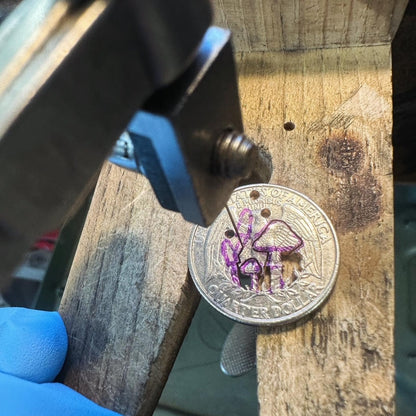 U.S. Custom Mushroom Quarter during the hand cutting process on a wood block. - Mountainstruck Coin Jewelry