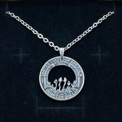 U.S. Custom Mushroom Quarter Hand Cut Coin Necklace with stainless chain on a black velvet background.- Mountainstruck Coin Jewelry