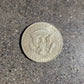 U.S. Eagle Half Dollar Silver Coin back on a concrete background. - Mountainstruck Coin Jewelry