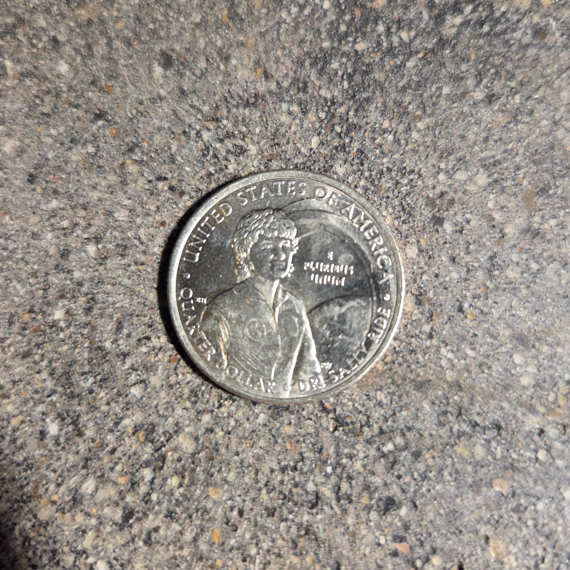 U.S. First American Woman in Space Coin back on a concrete background. - Mountainstruck Coin Jewelry