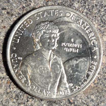 U.S. First American Woman in Space Coin back on a concrete background. - Mountainstruck Coin Jewelry