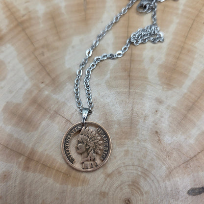 U.S. Indian Head Penny Hand Cut Coin Necklace on a wood background. - Mountainstruck Coin Jewelry