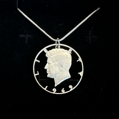 U.S. JFK Half Dollar Hand Cut Silver Coin Necklace with snake chain in a brown kraft box on black velvet background. - Mountainstruck Coin Jewelry