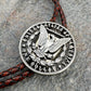 U.S. Morgan Hand Cut Silver Dollar Coin Bolo Tie (reverse) on a grey rock surface. - Mountainstruck Coin Jewelry