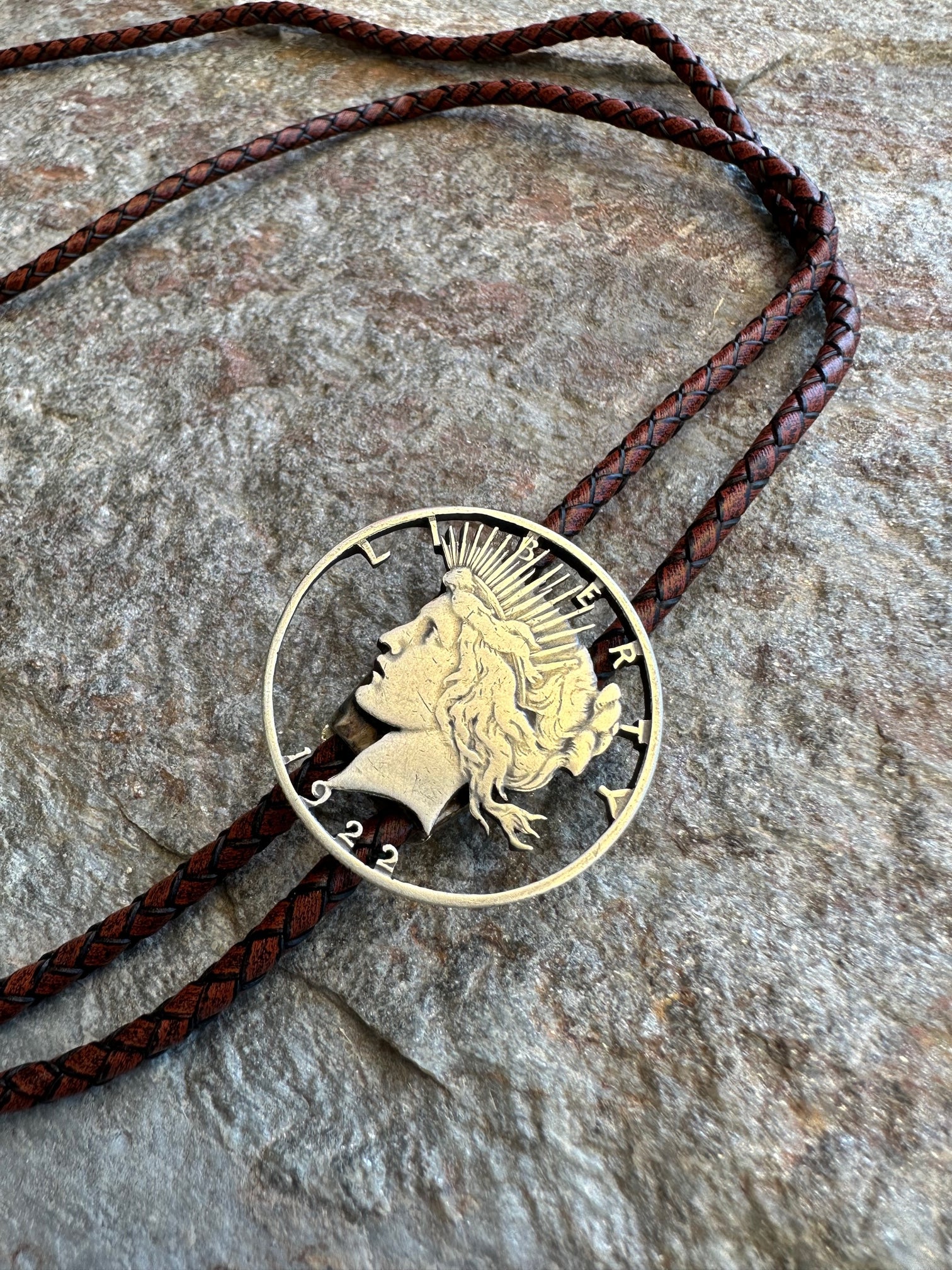 U.S. Peace Dollar Hand Cut Silver Coin Bolo Tie with a dark brown leather cord - Mountainstruck Coin Jewelry