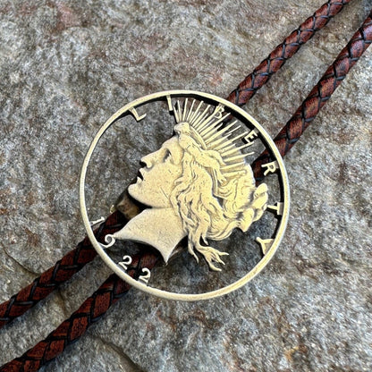 U.S. Peace Dollar Hand Cut Silver Coin Bolo Tie with a dark brown leather cord - Mountainstruck Coin Jewelry
