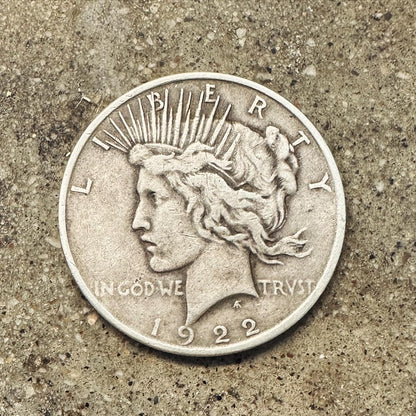 U.S. Peace Dollar Silver Coin
 front on a concrete background. - Mountainstruck Coin Jewelry
