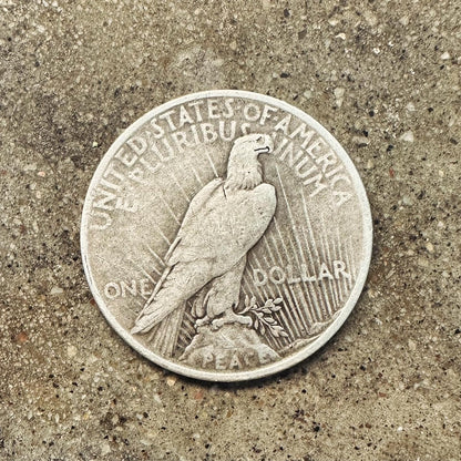 U.S. Peace Dollar Silver Coin back on a concrete background. - Mountainstruck Coin Jewelry