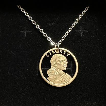U.S. Sacagawea 1 Dollar Hand Cut Coin Necklace with stainless chain on a black velvet background. - Mountainstruck Coin Jewelry