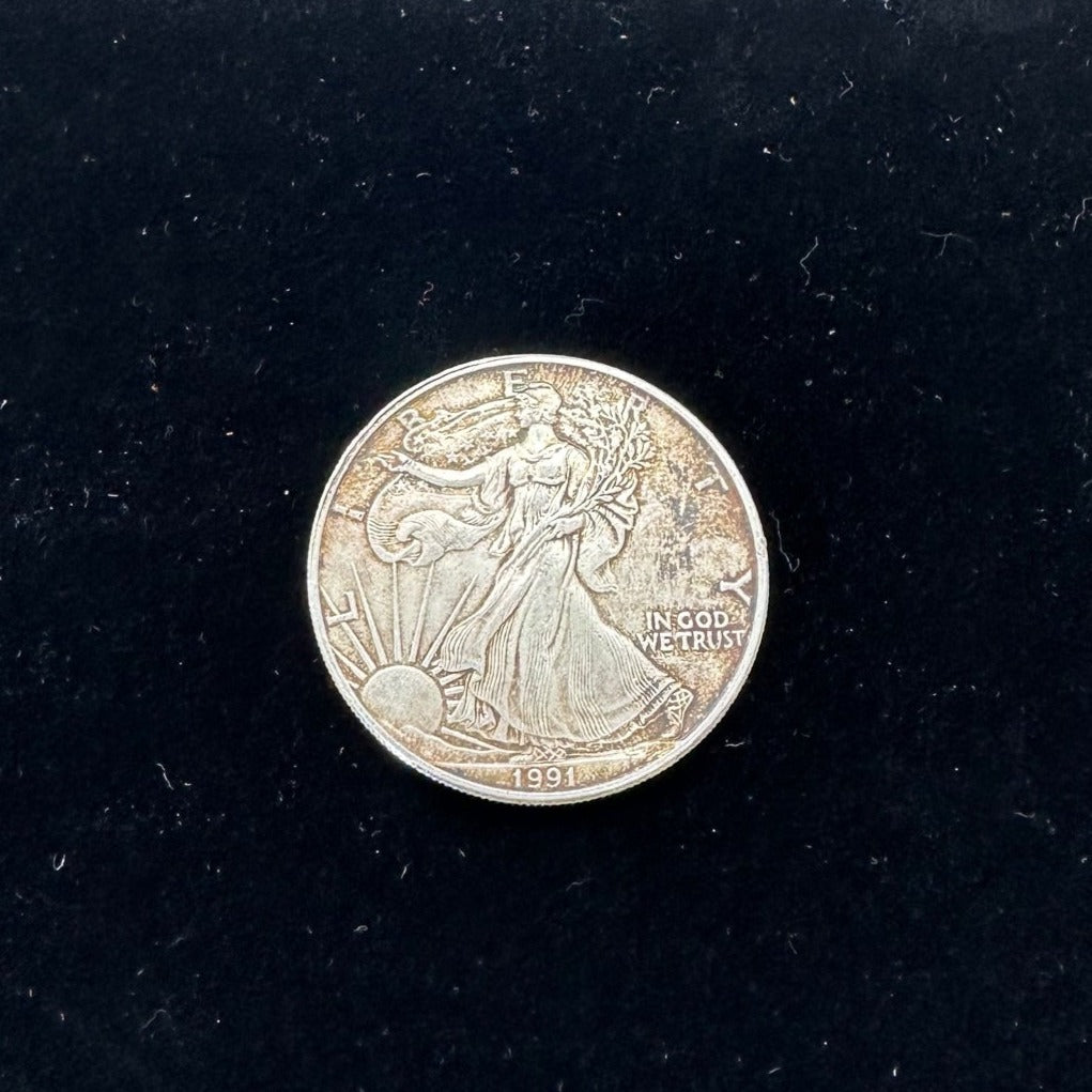 U.S. Silver Eagle coin front on a black velvet background. - Mountainstruck Coin Jewelry
