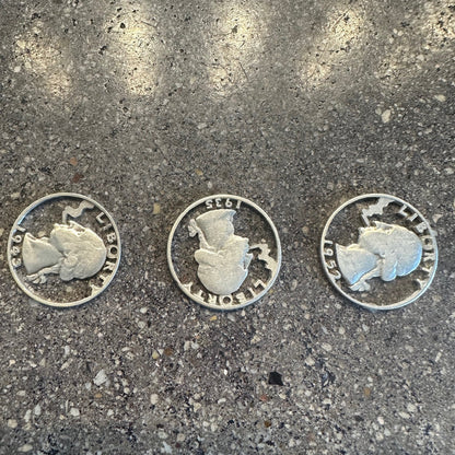 U.S. Smoking GW Silver Quarter Hand Cut Coins on a concrete background. - Mountainstruck Coin Jewelry