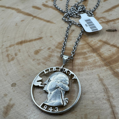 U.S. Smoking GW Silver Quarter Hand Cut Coin Necklace with a stainless chain on a wood background. - Mountainstruck Coin Jewelry