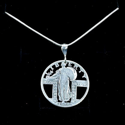 U.S. Standing Liberty Quarter Hand Cut Silver Coin Necklace back on a black velvet background. - Mountainstruck Coin Jewelry