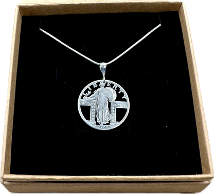 U.S. Standing Liberty Quarter Hand Cut Silver Coin Necklace back in a brown kraft box on a black velvet background. - Mountainstruck Coin Jewelry