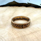 22k U.S. Gold Half Eagle $5 Coin Ring in a light wood round with metal mountains in the background. - Mountainstruck Coin Jewelry