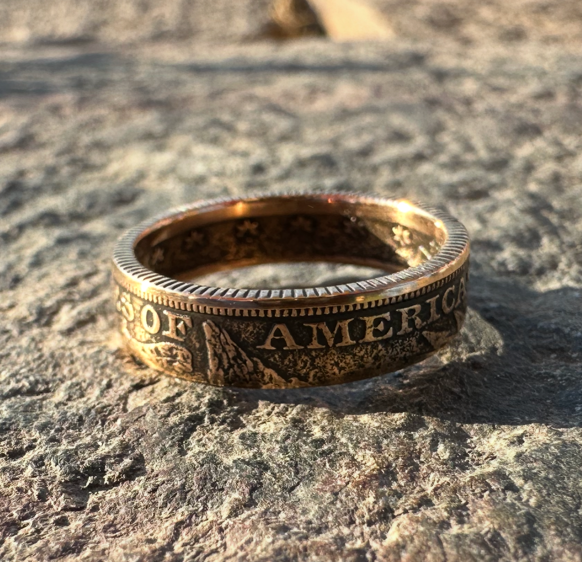 22k U.S. Gold Half Eagle $5 Coin Ring on a grey rock surface. - Mountainstruck Coin Jewelry