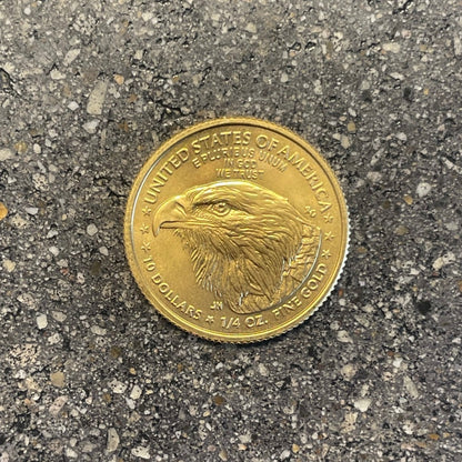 22k Gold U.S. Gold Eagle Coin front on a concrete background. - Mountainstruck Coin Jewelry