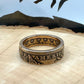 22k U.S. Gold Eagle $10 Coin Ring on a light wood round with a metal mountain background. - Mountainstruck Coin Jewelry