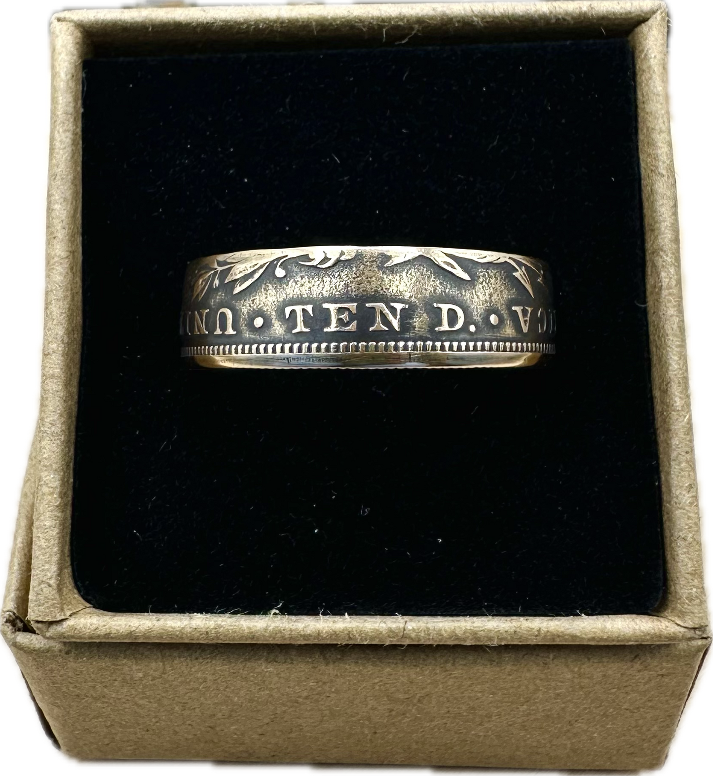 22k U.S. Gold Eagle $10 Coin Ring in a brown kraft box on a black velvet background. - Mountainstruck Coin Jewelry